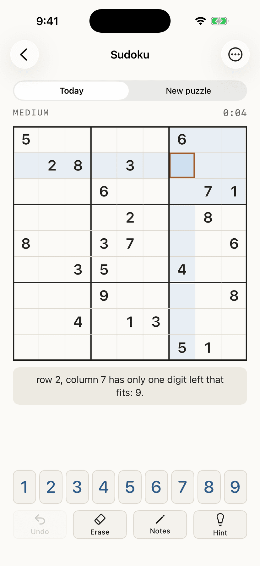 A sudoku board mid-game, with a hint explaining the next step in plain English.